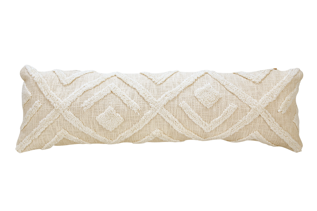 Large cream woven pillow with a geometric tufted design. Arrows, diamonds and triangles.