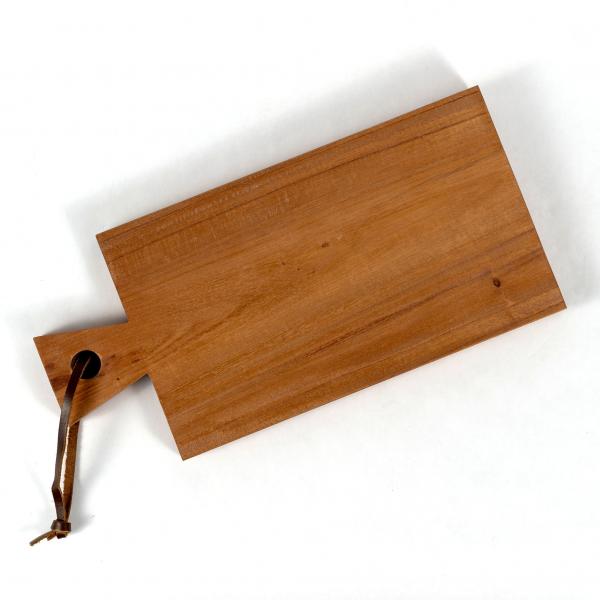 Handmade reclaimed wood cutting board with leather hanging strap. Rectangle with angled handle. White background.