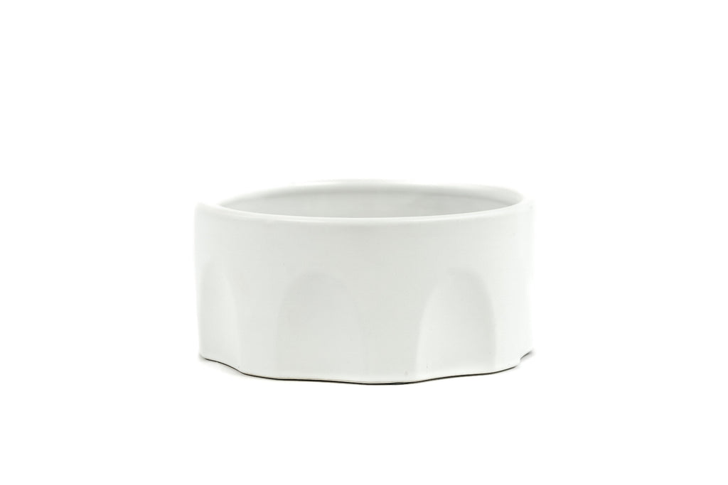 Large White Porcelain Bowls with arch design on the sides.