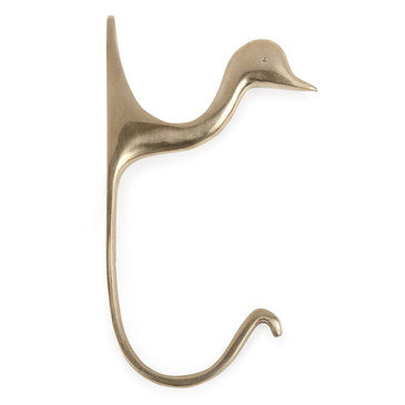Profile of brass duck hook on white background.