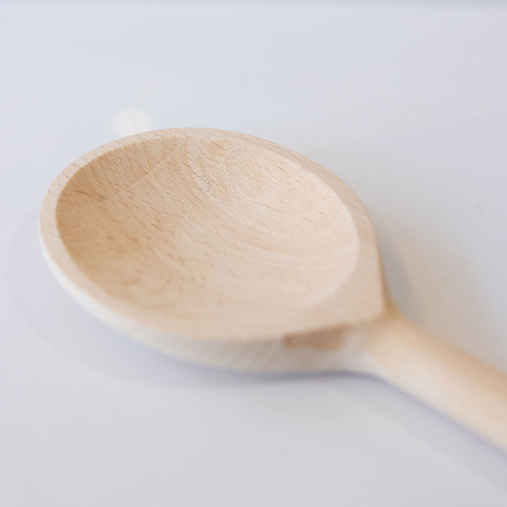 24" kitchen spoon handmade from beechwood. Close up of spoon end.