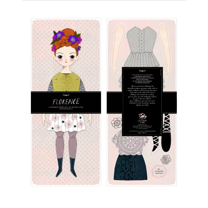 Paper doll kit. Features white girl with red hair as base paper doll with whimsical slightly Victorian fashion designs.
