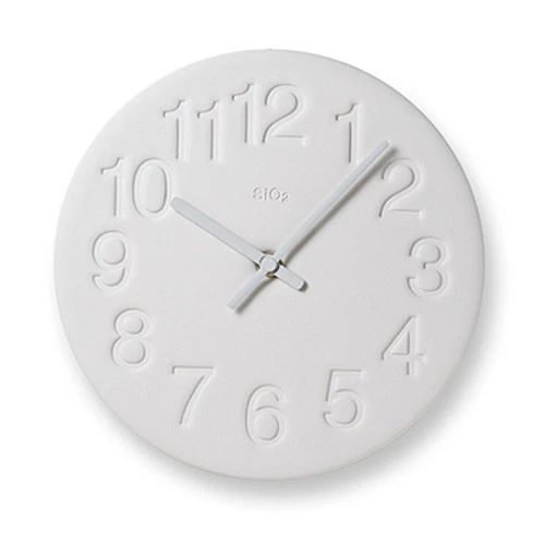 White clock made from diatomaceous earth with engraved numbers + white pink hands.