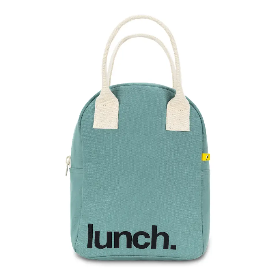 Soft sided teal cotton lunch bag with white canvas handles. Design is ‘lunch.’ printed in black on bottom left corner. White background.