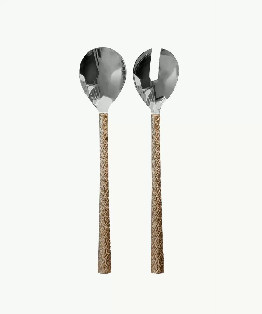 Salad server set with intricate brass handles and stainless steel spoon ends.