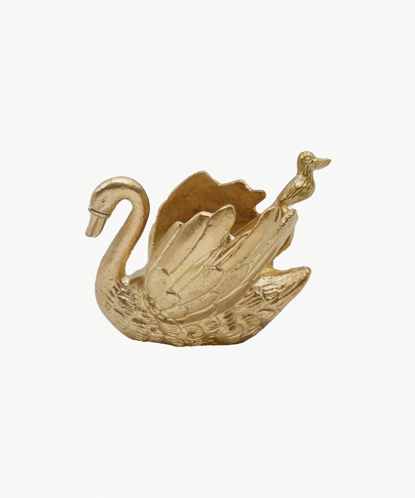 Recycled brass swan shaped condiment bowl with a baby swan adorned spoon. White background.